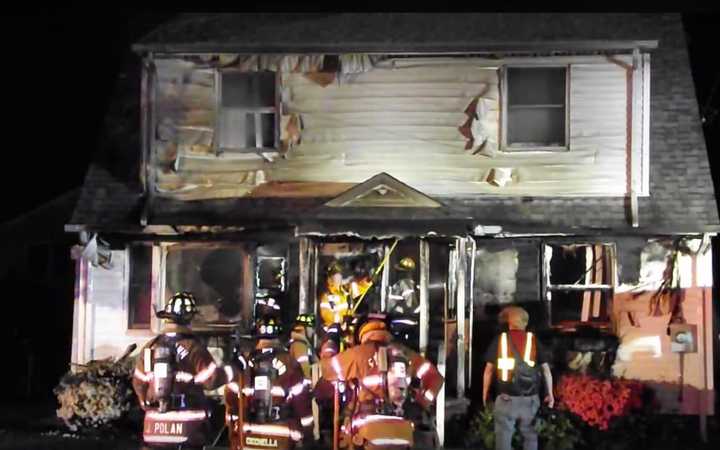 Two firefighters sustained ankle injuries during in 9:15 p.m. blaze, which began on the front porch of the Fern Street home.