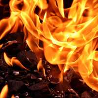 <p>A commercial building in the vicinity of 1900 Main Street has caught fire and is producing large black smoke clouds across the street.</p>