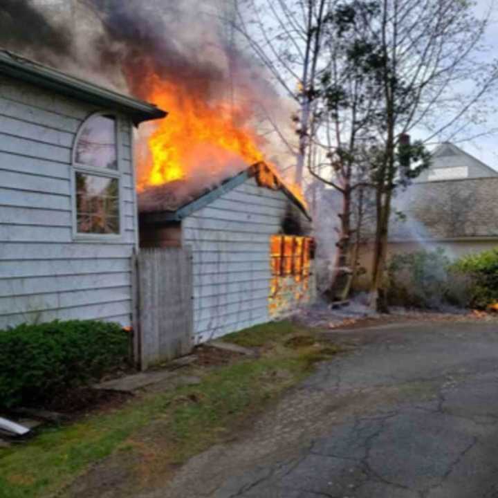 A home and detached garage were heavily damaged during a fire.