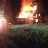 <p>Newtown Hook &amp; Ladder battles a blaze in a vacant home early Wednesday on Castle Hill Road.</p>