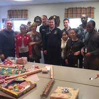 <p>Stamford firefighters and volunteers wrapped thousands of presents Friday. They will be delivered Saturday.</p>