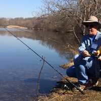 <p>Dan Handel and his grandson, Jack, try to reel in a fish at Garrett Mountain Reserve.</p>