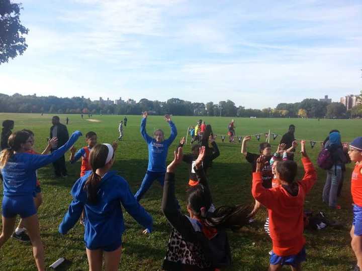 The Danbury Flyers cross country team warms up before the race. 