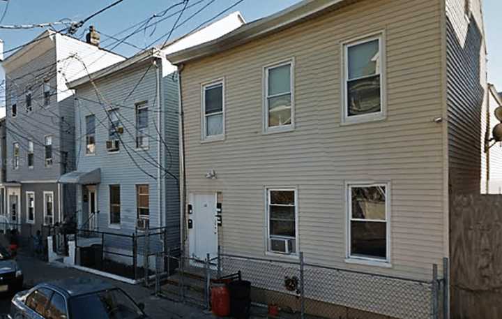 Police raided the home at right.