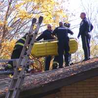 <p>Franklin Lakes firefighters using a Stokes basket brought the victim down.</p>