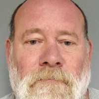Authorities: Norwood Man Assaults Mom, 83, Fights Police After Crashing Stolen Dump Truck
