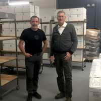 <p>Chris Fuentes (left) and Ted Kesten (right) stand in their warehouse with boxes of Ranger Ready ready to ship.</p>