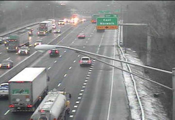 Roads may be slick across Fairfield County on Friday morning. Traffic is flowing on I-95 in Norwalk but the road is wet.