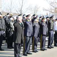 <p>Members of the Norwalk Police Department, joined by former chief and current Mayor Harry Rilling, salute retired Lt. Tim Murphy after his Mass of Christian Burial on Saturday at St. Aloysius Church in New Canaan.</p>