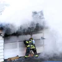 <p>At the scene of the March 10 fire at 155 Market Street in Garfield.</p>