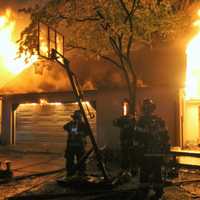 <p>The fire broke out on the second floor of the Cedar Street garage in Garfield shortly after 2 a.m. Monday, May 1.</p>