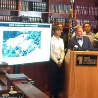 <p>Personal injury lawyer Samuel L. Davis with his clients at news conference in Teaneck.</p>