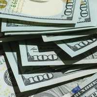 <p>The woman is laughing her way to the bank after winning big.</p>