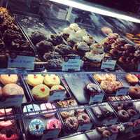 <p>Jule Hazous creations await consumption in Glaze Donuts, in New Milford.</p>