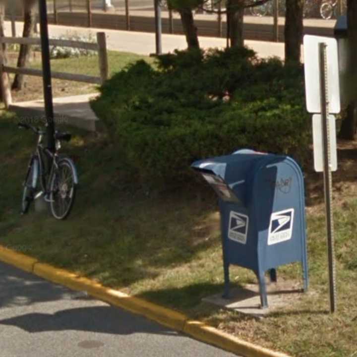 The victim using the US Postal Service mailbox on West Plaza near the Source Building, police said.