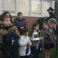 <p>Rockland County Executive Ed Day talks with students from the Chabad Hebrew School at menorah-lighting ceremonies celebrating Hanukkah in New City Tuesday.</p>