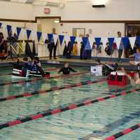 <p>Heat finalists competing at the Rye YMCA's 4th annual Cardboard Boat Regatta at Brookside pool on Friday.</p>