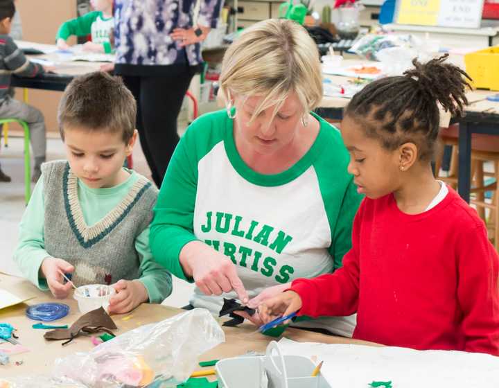 Greenwich Public School art teacher Le Ann Hinkle works with her students.