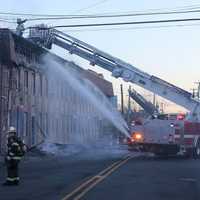 <p>Part of the flaming cornice and soffit fell into the street.</p>