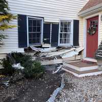 <p>Firefighters worked to stabilize the home in Hopkinton.</p>