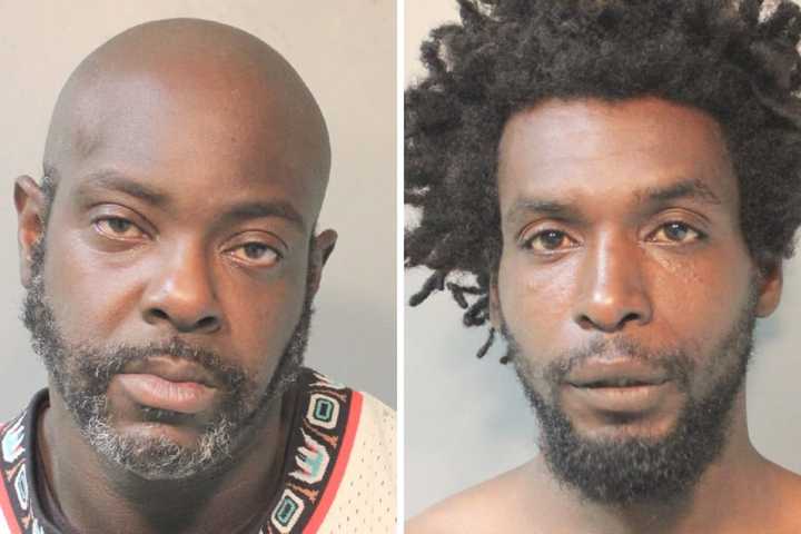 Palo Howe and Dwayne Smith were arrested following an incident where Howe ripped a chunk of wood off a telephone pole and chased Smith with it, police said.