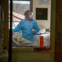 <p>Health care workers with a patient at Holy Name Medical Center.</p>