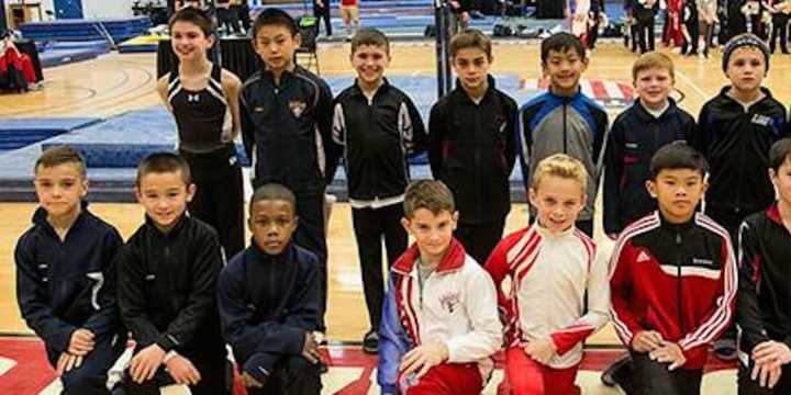 Eli Osuna, pictured third from left in the top row, poses for a photo with the 10-year-old Junior National Team.