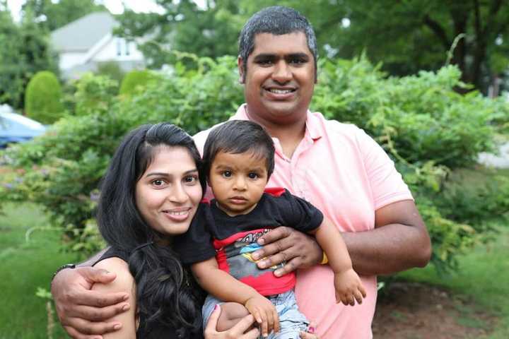 Ryan Mathew Roy, of Saddle Brook, poses with his wife and son.