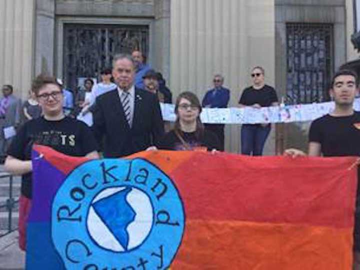 County Executive Ed Day at Wednesday&#x27;s vigil with, from left, Blair Abney, Kai Nielson and Adam Zaydenband.