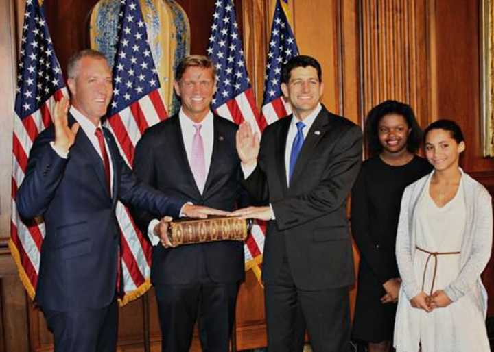 Rep. Sean Patrick Maloney, D-Cold Spring, left, poses during a swearing-in photo op Tuesday with husband, Randy Florke, second from left, and U.S. House Speaker Paul Ryan, R-Wis. Maloney and and Florke&#x27;s two daughters, Daley and Essie, look on.