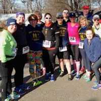 <p>Runners at the finish line of the third annual 5K Run/Walk fundraiser for the Junior League of Eastern Fairfield County.</p>