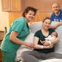 <p>New family joined by nurses from the Kennedy Birthing Center at St. Anthony Community Hospital.</p>