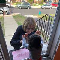 <p>Daria Baricevic of Lodi reunites with granddaughter Gabriela of Wood-Ridge while practicing social-distancing.</p>