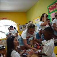 <p>Hooters Girls interacting with students at Gateway Christian Academy in Bimini</p>