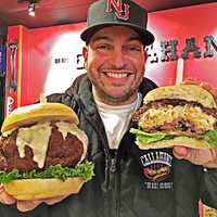 <p>Dan DeMiglio holds the gouda mac and cheese truffle burgers sold exclusively at Callahan&#x27;s in Norwood.</p>