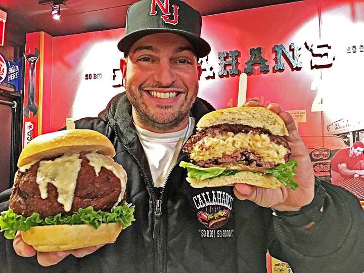 Dan DeMiglio holds the gouda mac and cheese truffle burgers sold exclusively at Callahan&#x27;s in Norwood.