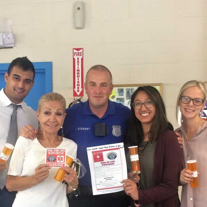 (From left): Danny Seligson of Golden Health Care Pharmacy, resident Nilda Lopez , OfficerJeff Stewart, social workers EJ Nicolas and Jana Devaney.