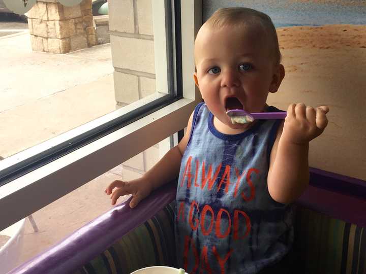 Young Greyson of Oklahoma enjoys frozen yogurt at Cups on Route 3 in Clifton while visiting family.