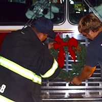 <p>Lt. Chris DiMauro and firefighter Devin Vitti of Phoenix Hose Company #8 putting on the finishing touches for the parade. </p>