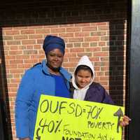 <p>Ossining students, parents and teachers took part in a rally at Market Square on Thursday to protest drastic cuts in state aid.</p>