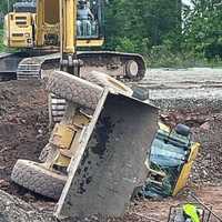 Front Loader Tips, Lands On Driver In Bogota