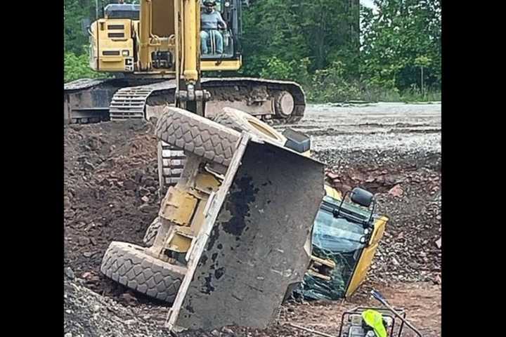 Front Loader Tips, Lands On Driver In Bogota