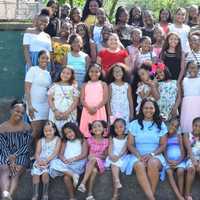 <p>Attiyya Barrett (front row, center) with the girls and chaperone.</p>