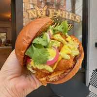 <p>Peruvian Fried Chicken: w/ají amarillo and ají verde sauces, pickled onions, cilantro, scallions and sriracha mayo</p>