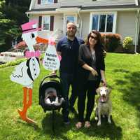 <p>The Galarza family poses in front of their Wayne home.</p>