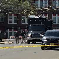 <p>Investigators were concentrated in the area of a Portland Avenue parking lot behind a string of South Washington Avenue businesses across from the Roy W. Brown Middle School.</p>