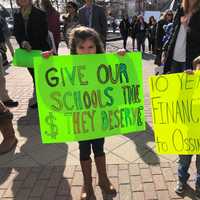 <p>Ossining students, parents and teachers took part in a rally at Market Square on Thursday, March 22 to protest drastic cuts in state aid. Children shouted: &quot;Show me the money,&quot; to Gov. Andrew Cuomo of neighboring New Castle.</p>