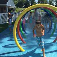 <p>Bradon, 6, of Fair Lawn, cools off from the extreme heat.</p>