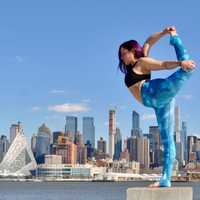 <p>Cheryl Feinberg of River Vale balances at the Weehawken Waterfront.</p>