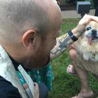 <p>Rev. Andy Smith blesses Sushi the Pekingese, who is blind and deaf, at the Grace United Presbyterian Church&#x27;s annual &quot;Blessing of the Animals&quot; Thursday.</p>